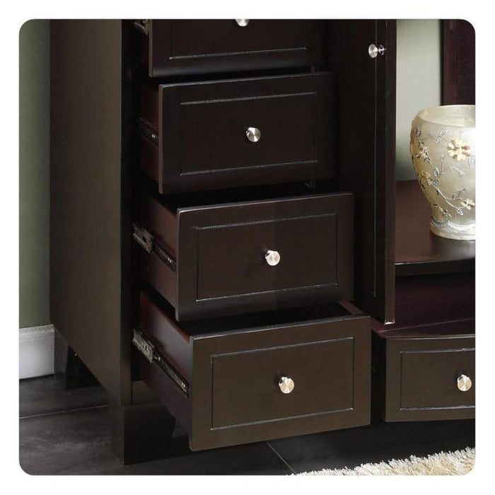 Dark wood file cabinet with three open drawers, silver round knobs, and decorative ceramic vase on adjacent surface