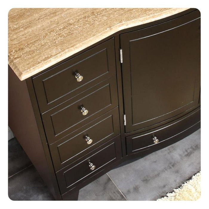 Dark wood dresser with travertine top, four drawers, and decorative silver knobs, curved front design.