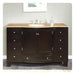 Dark wood bathroom vanity with travertine top, six drawers, center cabinet, and undermount sink with chrome faucet fixtures.