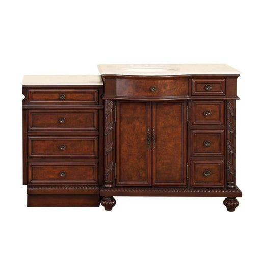 Rich mahogany bathroom vanity with cream marble top, featuring multiple drawers and center cabinet with ornate hardware and decorative carved details.