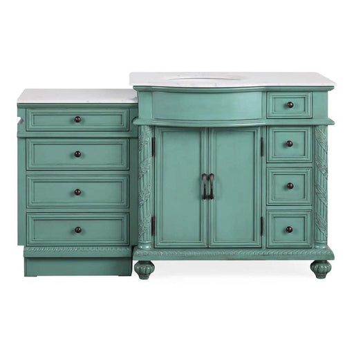 Vintage-style teal bathroom vanity with white marble top, six drawers, and center cabinet with decorative hardware and carved details.