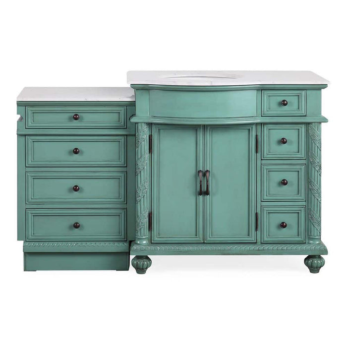 Vintage-style teal bathroom vanity with white marble top, six drawers, and center cabinet with decorative hardware and carved details.