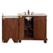 Dark wood bathroom vanity with white marble top and oval sink, bronze faucet fixtures, and open storage shelf.