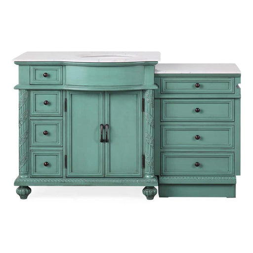 Vintage-style seafoam green bathroom vanity with white marble top, featuring cabinet and five drawers with ornate details and round knobs.