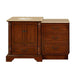 Traditional wooden bathroom vanity with ornate carved columns, beige stone top, and three drawers with antique handles.