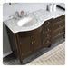 Dark brown bathroom vanity with white marble countertop, oval undermount sink, and brushed nickel faucet fixtures.