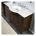Dark wood bathroom vanity with white marble countertop, oval sink, and brushed nickel faucet fixtures.