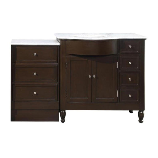 Dark wood bathroom vanity with white marble top, central cabinet, and multiple drawers with round silver knobs.
