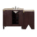 Dark wood bathroom vanity with beige stone top and oval white sink, featuring chrome faucet and cabinet storage.