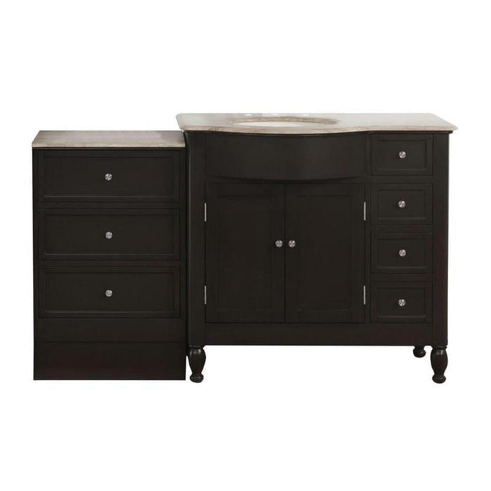 Dark wood bathroom vanity with marble top, center cabinet and side drawers, decorative turned legs and round sink.