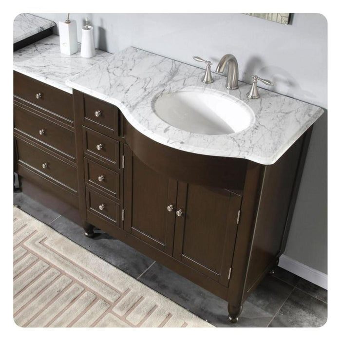 Dark wood bathroom vanity with white marble countertop, oval undermount sink, and brushed nickel faucet fixtures.