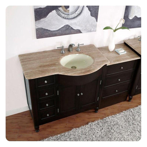 Dark wooden bathroom vanity with travertine countertop, oval sink, and decorative wall art with soft gray tones