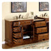 Rich wood bathroom vanity with multiple drawers open, revealing storage space and rolled towels, flanked by marble sinks and decorative wall art.