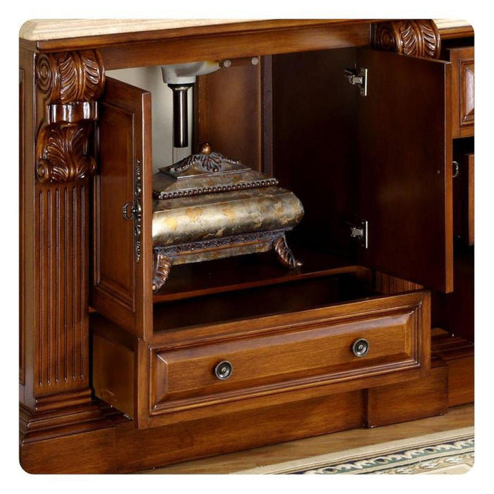 Ornate wooden cabinet with carved details, open door revealing antique decorative box and drawer below with round brass handles.