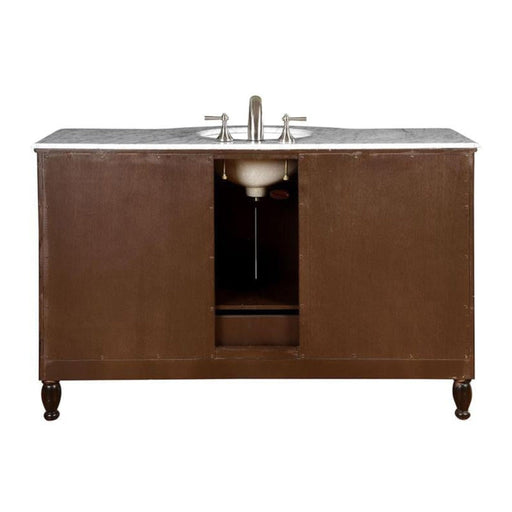 Dark brown wooden bathroom vanity with marble top and silver faucet, featuring ornate turned legs and center cabinet opening.