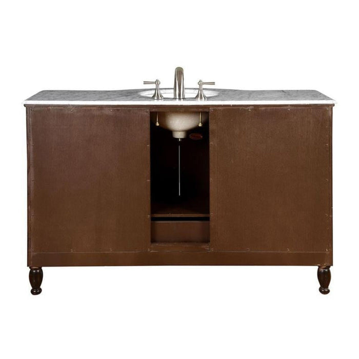 Dark brown wooden bathroom vanity with marble top and silver faucet, featuring ornate turned legs and center cabinet opening.