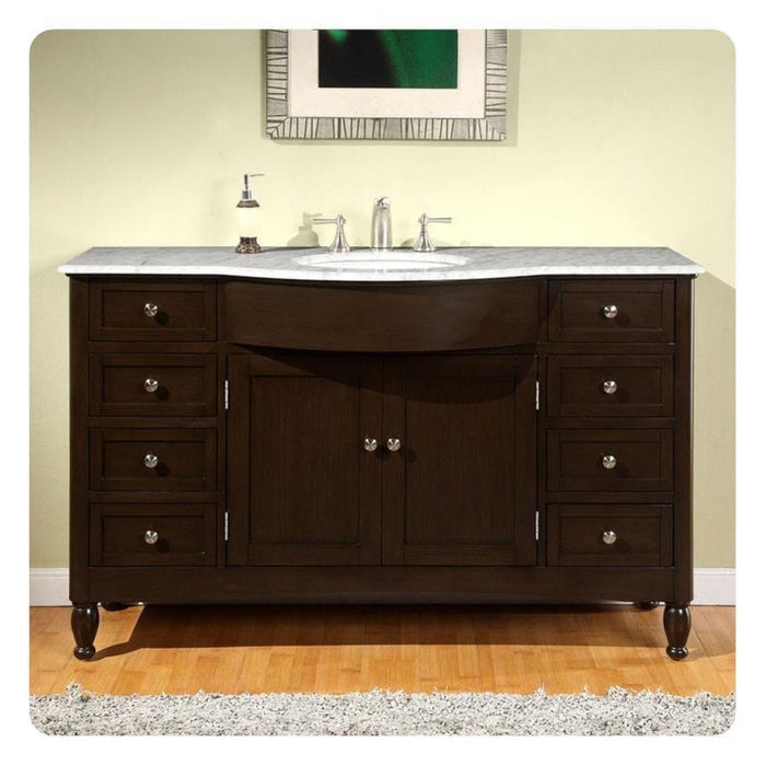 Dark wood bathroom vanity with white marble top and oval sink, eight drawers, and central cabinet doors with decorative knobs.