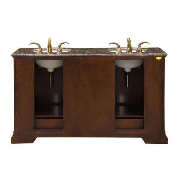 Dark wood double vanity with marble top and three gold faucet fixtures over two white undermount sinks