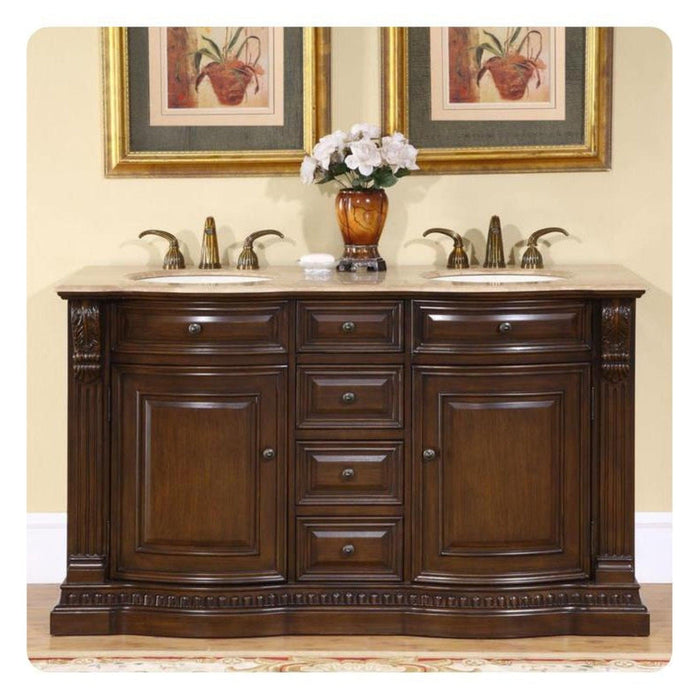 Dark wood double bathroom vanity with marble top, two sinks, and framed botanical art above