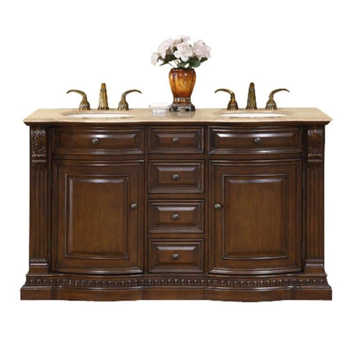 Rich wood bathroom vanity with marble top, two sinks, decorative hardware, and white flowers in amber vase.