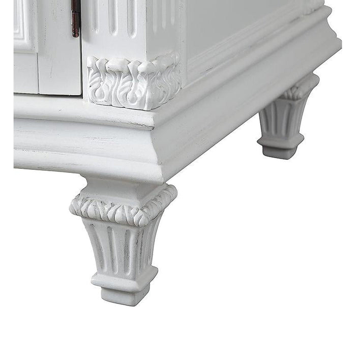 White ornate furniture leg with intricate carved details and classical architectural styling, showing decorative molding and a fluted design.