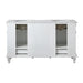 White double-sink bathroom vanity with decorative carved feet, two open storage compartments, and marble-like countertop.