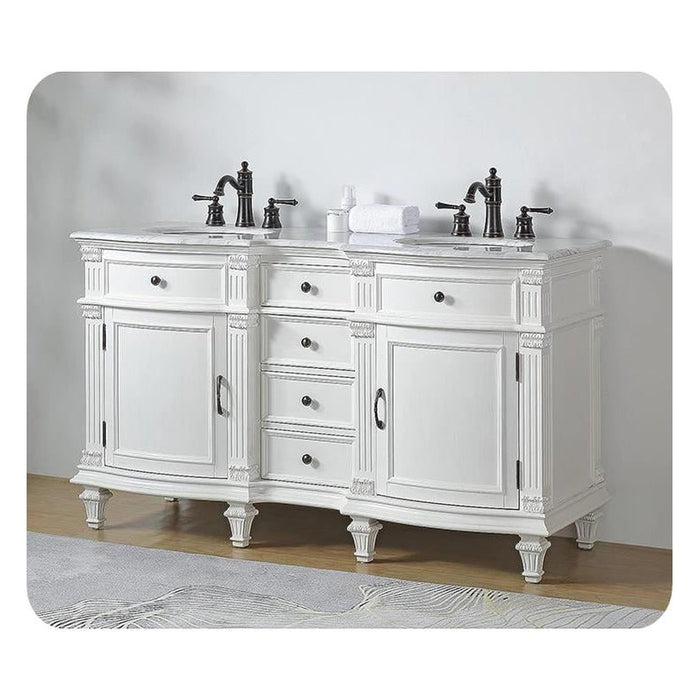 White double vanity with ornate details, black faucets, and four drawers centered between two cabinet doors