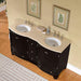 Black curved bathroom vanity with double sinks, cream countertop, and framed fern art prints against a beige wall.