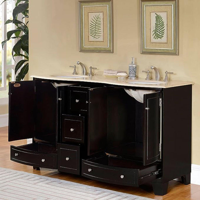 Black bathroom vanity with double sinks, marble countertop, open drawers, and fern artwork hanging on beige wall