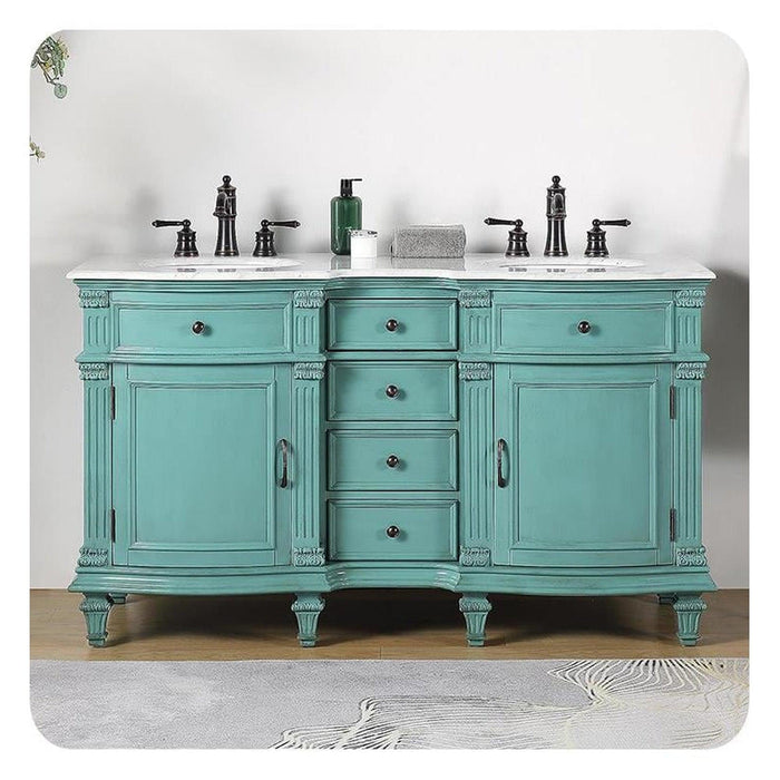 Vintage-style double vanity in mint green with white marble top, black fixtures, and ornate carved details on curved legs.