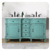 Vintage-style double vanity in mint green with white marble top, black fixtures, and ornate carved details on curved legs.