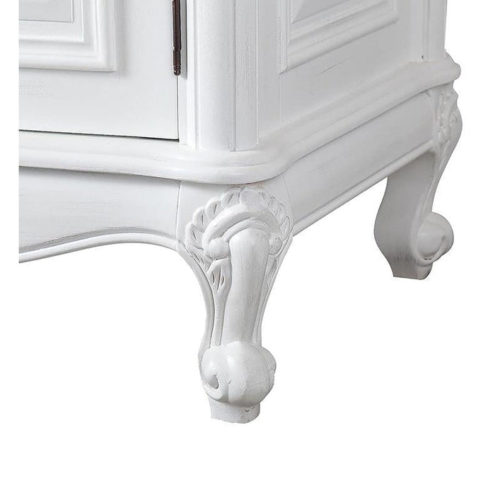 White ornate cabinet leg with curved cabriole design and decorative carved details, showing elegant Rococo-style craftsmanship.