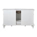 White bathroom vanity with marble top, decorative legs, and center storage compartment with drawers.