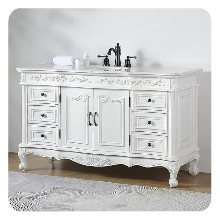 Elegant white bathroom vanity with ornate carved details, black faucet, and six drawers on cabriole legs