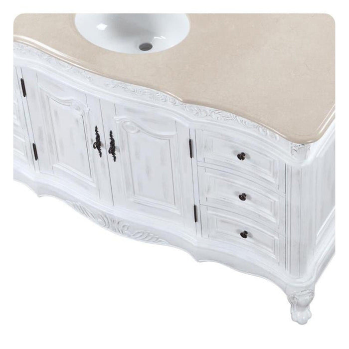 White vintage-style bathroom vanity with carved details, curved base, and round white sink
