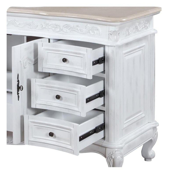 White shabby chic side table with three open drawers, ornate carved details, and curved cabriole legs.