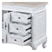White shabby chic side table with three open drawers, ornate carved details, and curved cabriole legs.