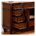 Ornate wooden dresser with multiple open drawers, dark cherry finish and decorative carved details on corners and legs.
