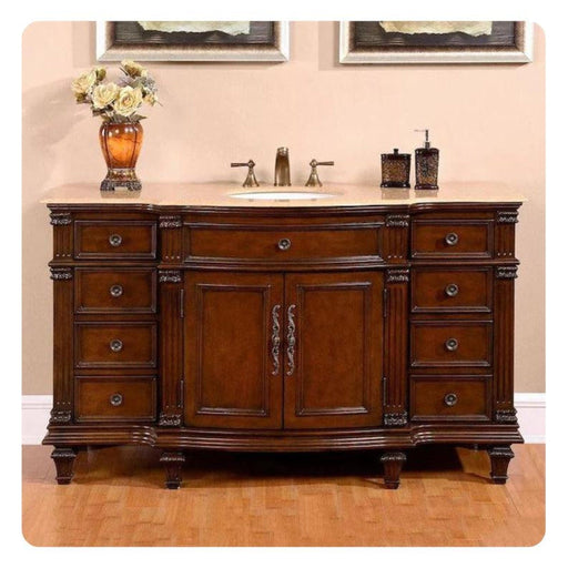 Rich wood bathroom vanity with curved edges, eight drawers, central sink, and decorative hardware, topped with yellow roses in an amber vase.