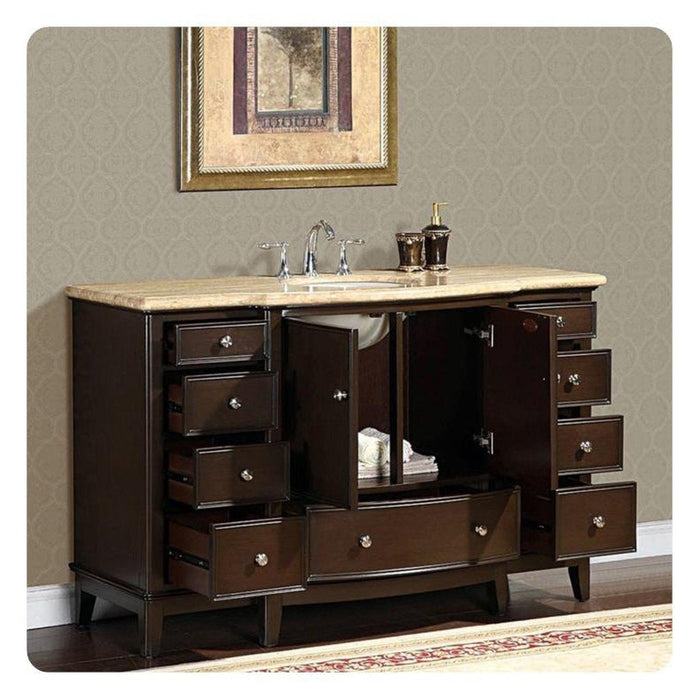 Dark wood bathroom vanity with marble top, multiple drawers open, displaying bathroom accessories and storage space.