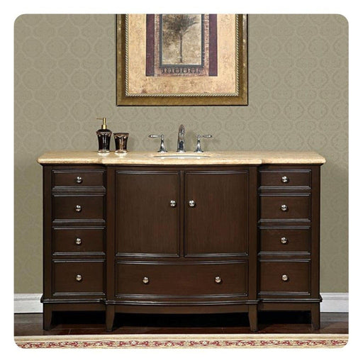 Dark wood bathroom vanity with marble top, central sink, decorative hardware, and framed tree artwork above.