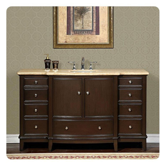 Dark wood bathroom vanity with marble top, central sink, decorative hardware, and framed tree artwork above.