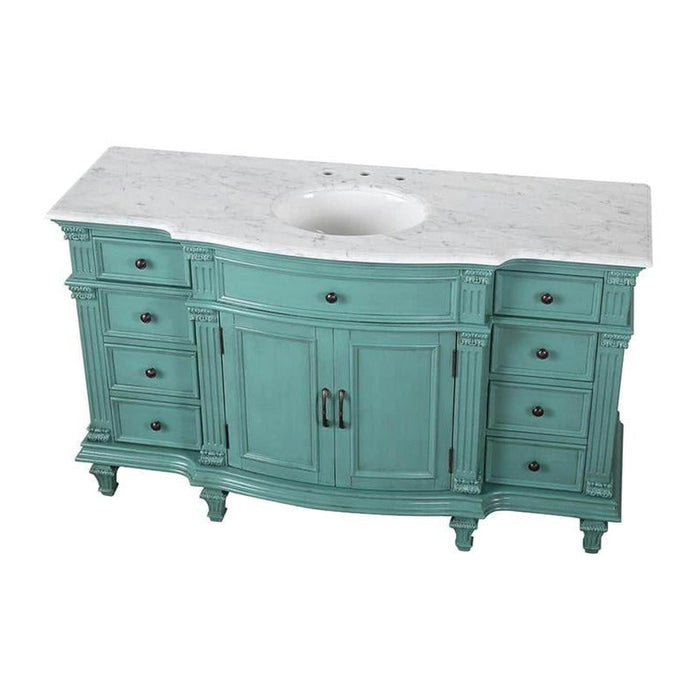 Vintage teal bathroom vanity with curved design, white marble top, six drawers, center cabinet, and ornate carved details.