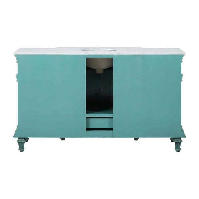 Turquoise bathroom vanity with white marble top, decorative carved legs, and center drawers with open cabinet space