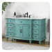 Vintage-style teal bathroom vanity with white marble top, six drawers, center cabinet, and ornate black faucet fixtures.