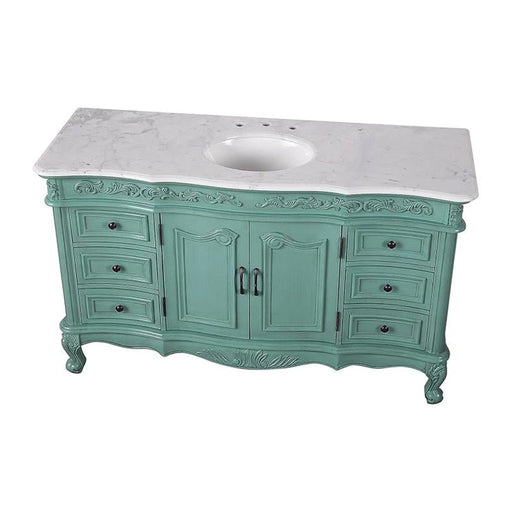 Vintage-style sage green bathroom vanity with curved legs, ornate details, and white marble top with oval sink.