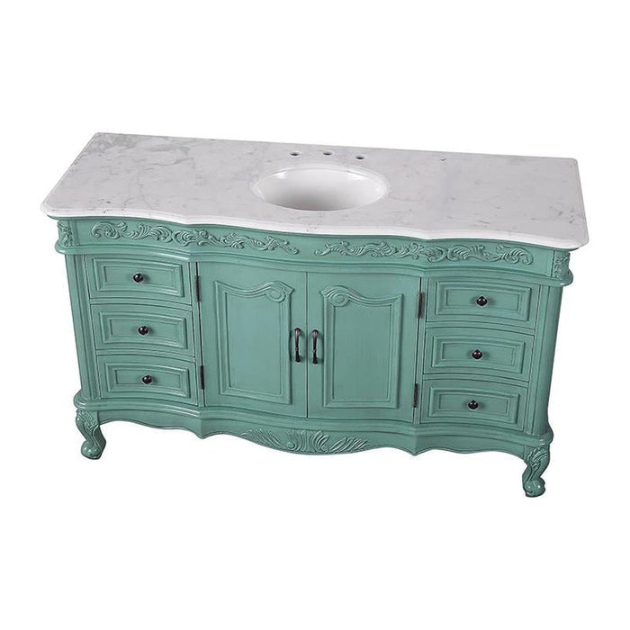 Vintage-style sage green bathroom vanity with curved legs, ornate details, and white marble top with oval sink.