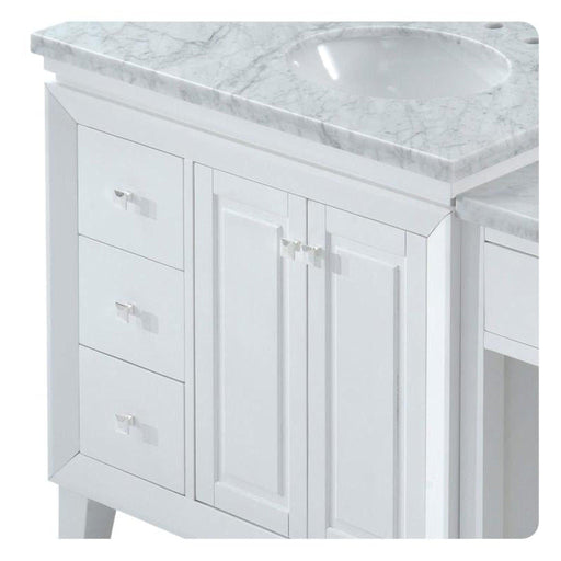 White bathroom vanity with marble countertop, three drawers, and center cabinet with double doors and silver hardware.