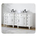 Elegant white bathroom vanity with ornate details, black faucets, and multiple drawers on decorative turned legs.