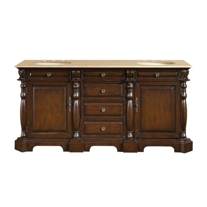 Dark wood bathroom vanity with ornate turned columns, cream marble top, three center drawers, and two side cabinets.